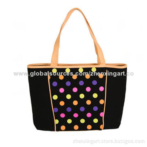 Black canvas handbag with colorful dots